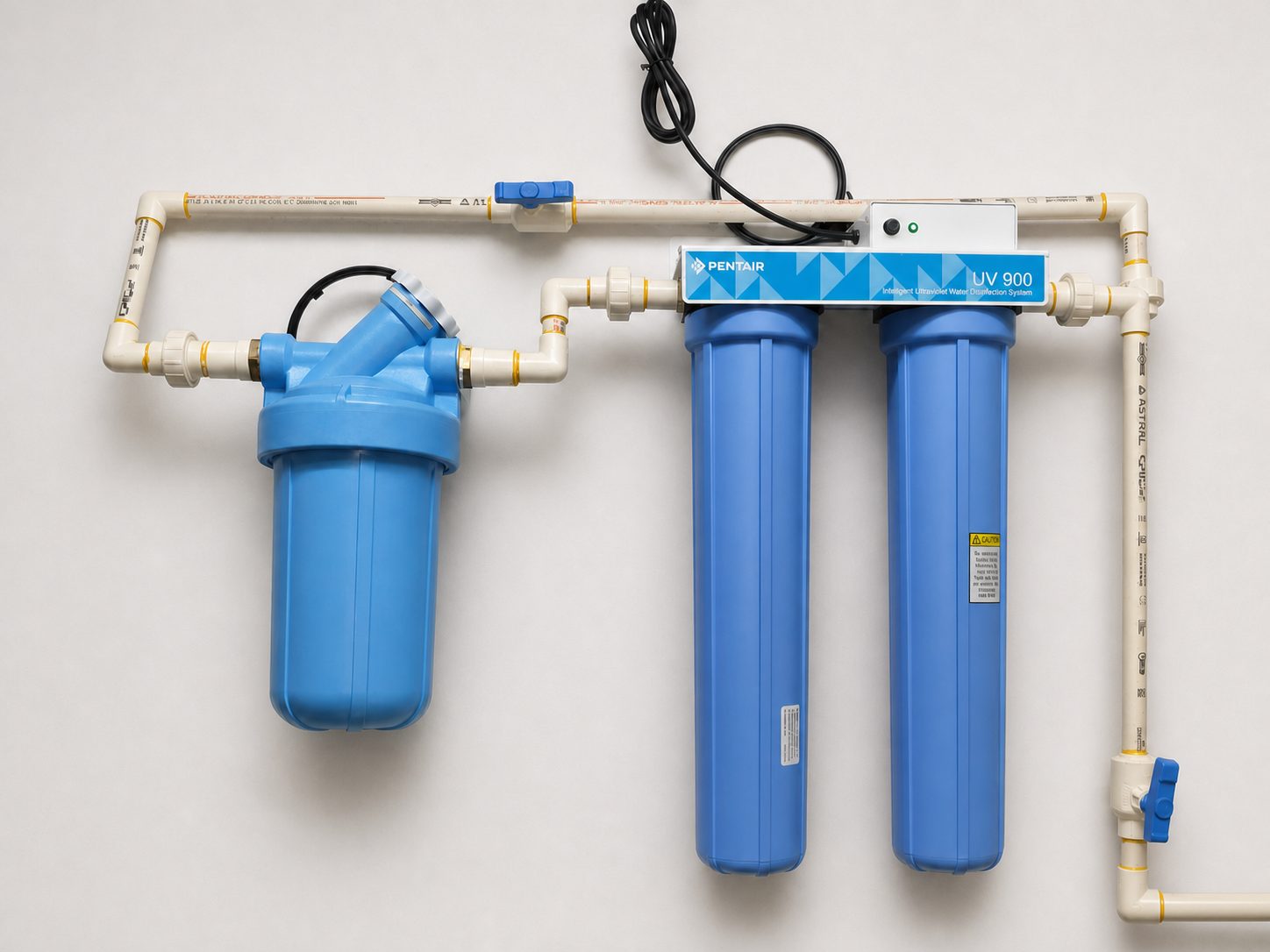 Pentair UV 900 disinfection with spin-down and big-blue sediment and carbon pre-filtration at a three-sink commercial kitchen station